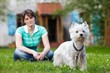 woman with young West Highland White Terrier 03